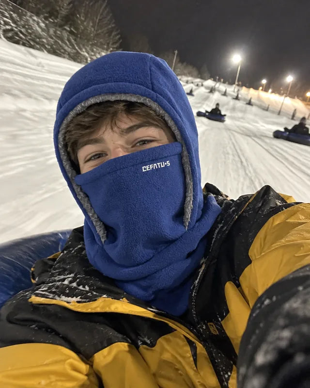 Blue winter hood selfie on a snowy night