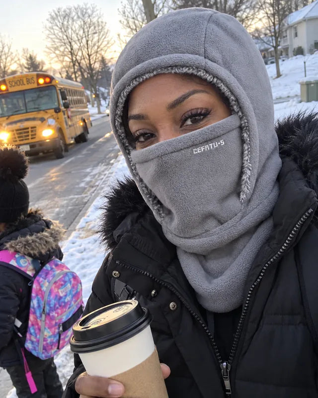 Gray winter hood selfie beside a school bus