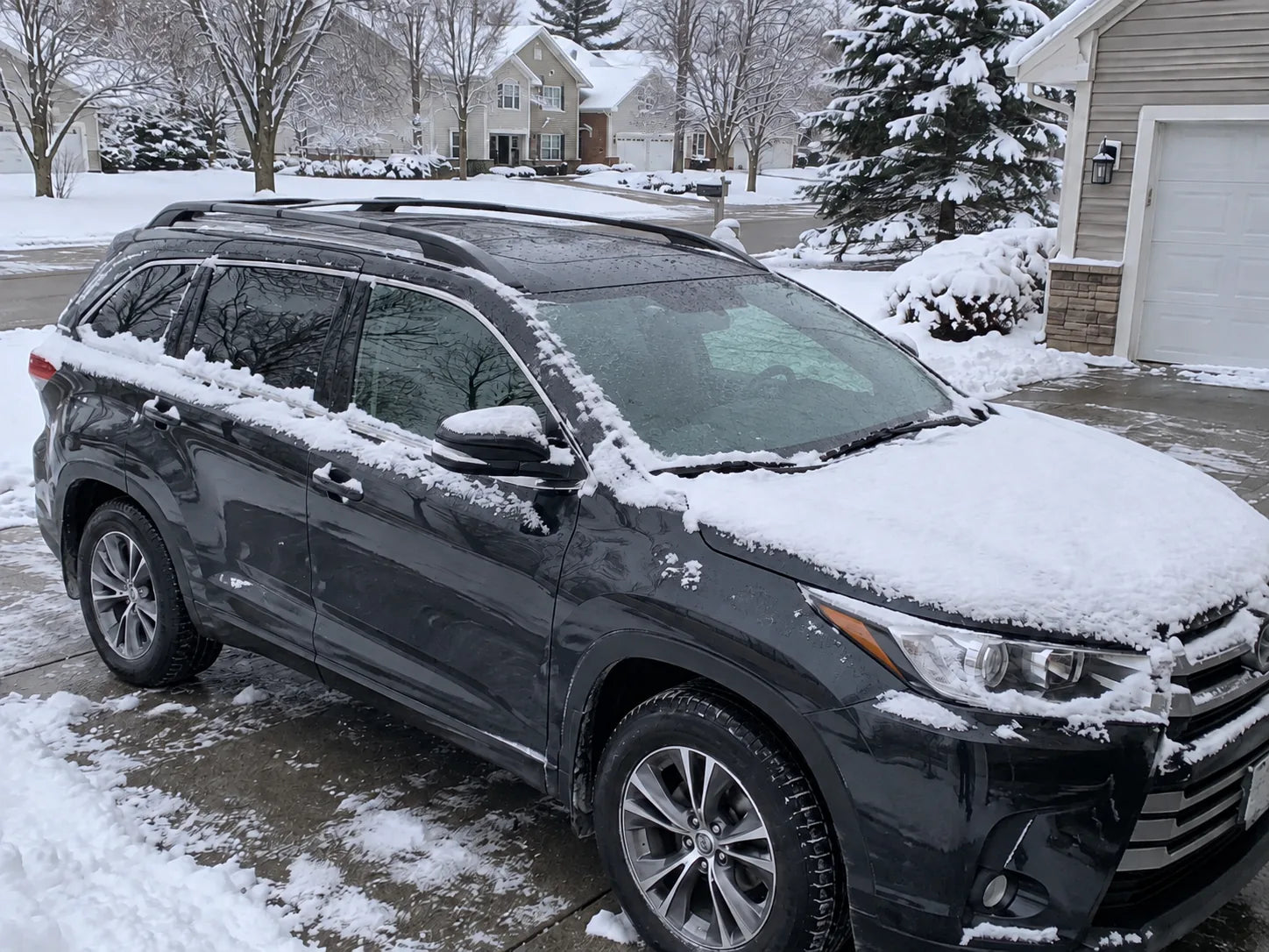 Snow-covered car before cleanup
