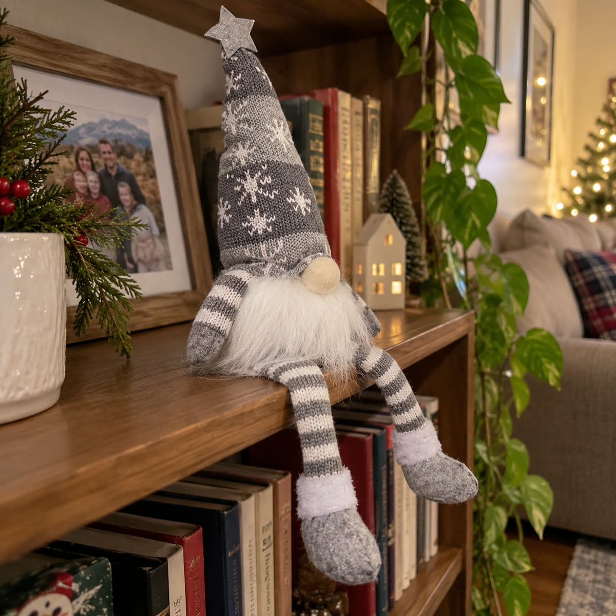 Customer photo of gray Christmas doll sitting on a bookshelf