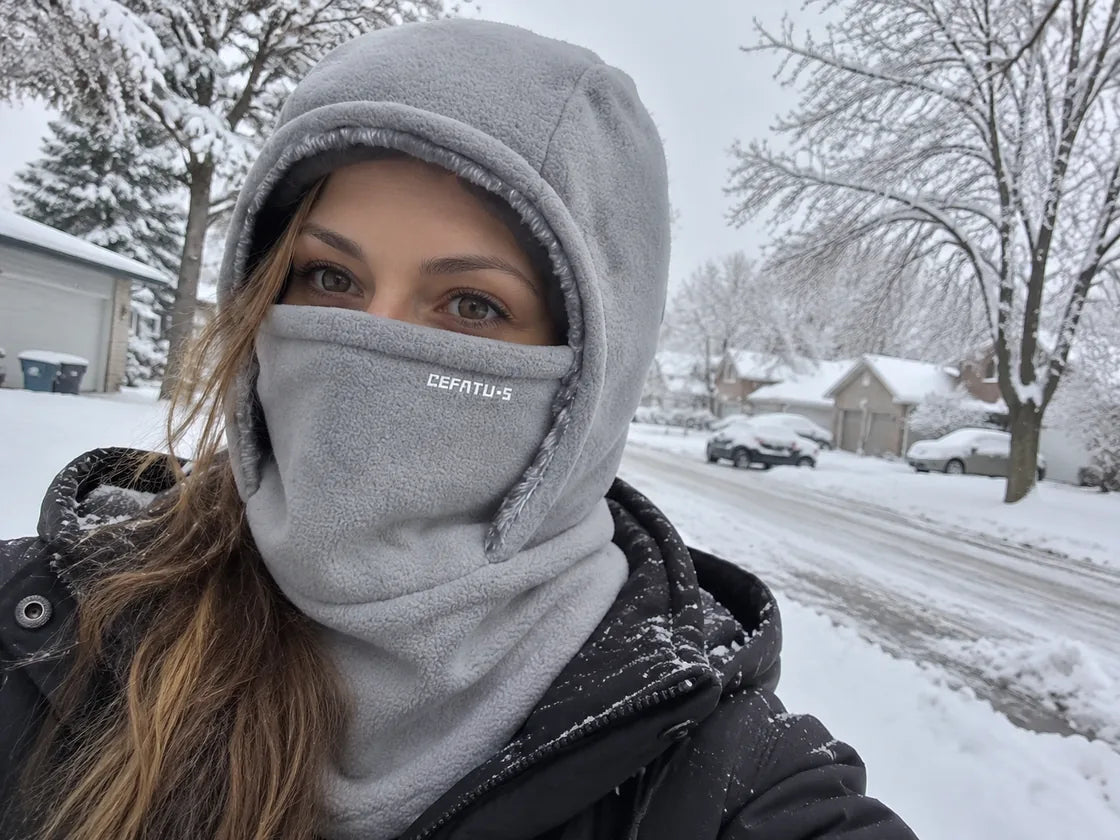 Light gray winter hood on a snowy neighborhood walk