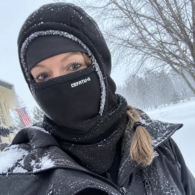 Black winter hood selfie in falling snow
