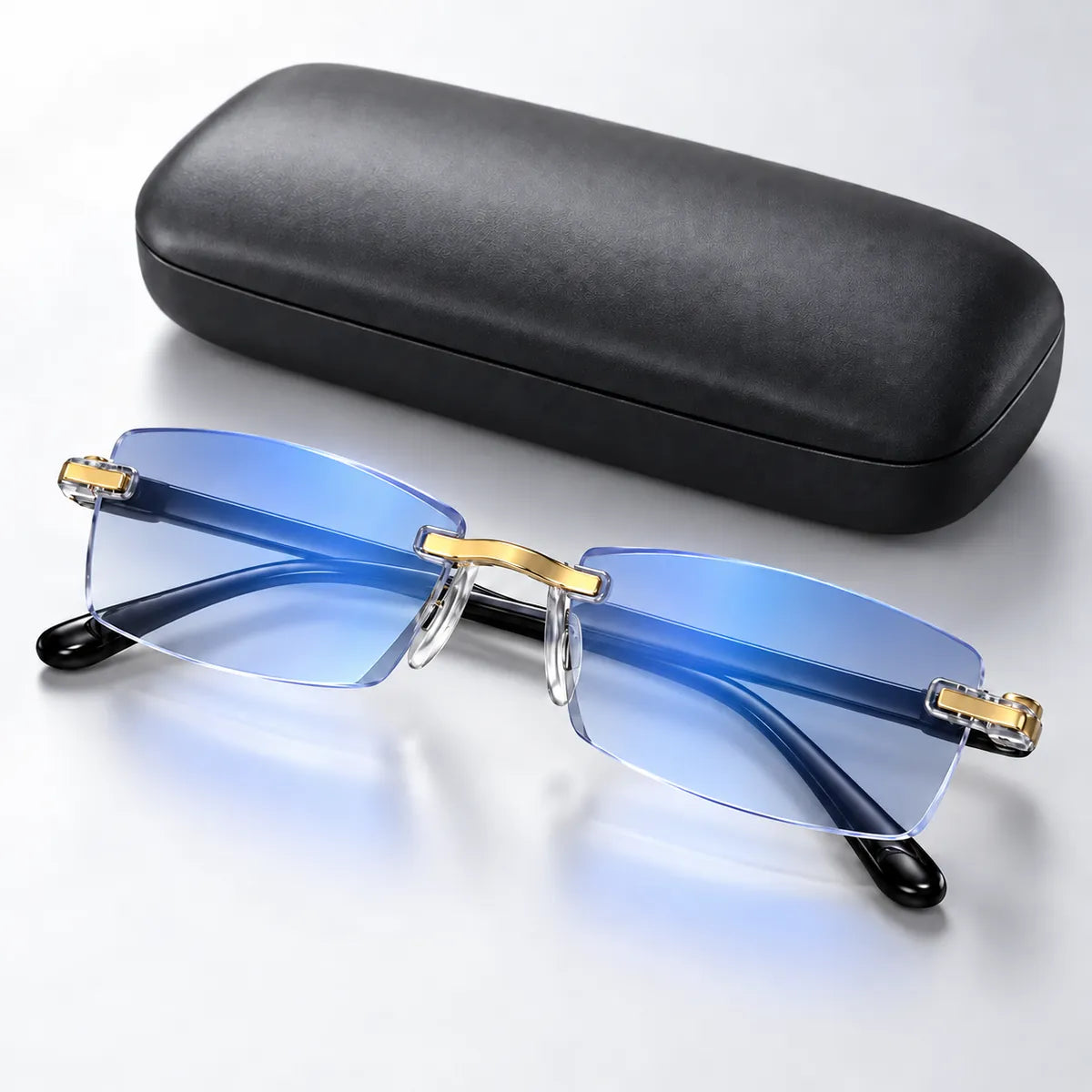 Blue-light rimless glasses with gold accent details and black case